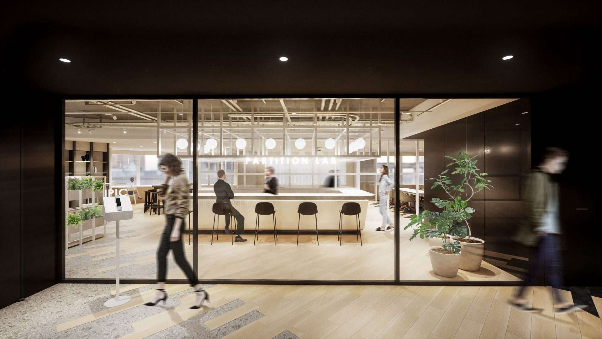 アイピック株式会社新オフィスのエントランス。ガラスパーテーションの開放感溢れるエントランス